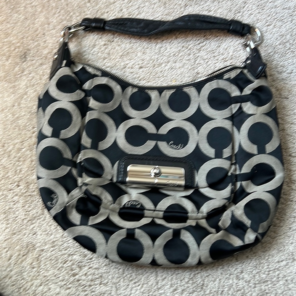 Authentic Coach purse, gentle use.  Inside looks more orange than pink